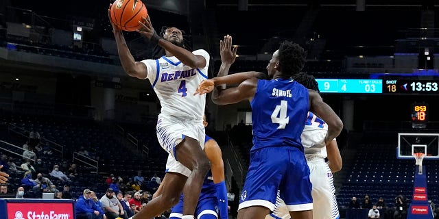 DePaul's Javon Freeman-Liberty (4) drives to the basket past Seton Hall's Tyrese Samuel (4) during the first half of an NCAA college basketball game Thursday, Jan. 13, 2022, a Chicago.