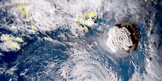 In this satellite image taken by Himawari-8, a Japanese weather satellite, and released by the agency, shows an undersea volcano eruption at the Pacific nation of Tonga Saturday, Jan. 15, 2022. An undersea volcano erupted in spectacular fashion near the Pacific nation of Tonga on Saturday, sending large waves crashing across the shore and people rushing to higher ground. (Japan Meteorology Agency via AP)