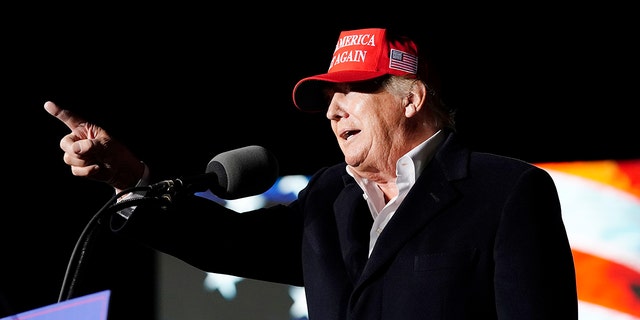 Former President Donald Trump points to the crowd as he speaks at a Save America Rally Saturday, Jan. 15, 2022, in Florence, Ariz. (AP Photo/Ross D. Franklin)