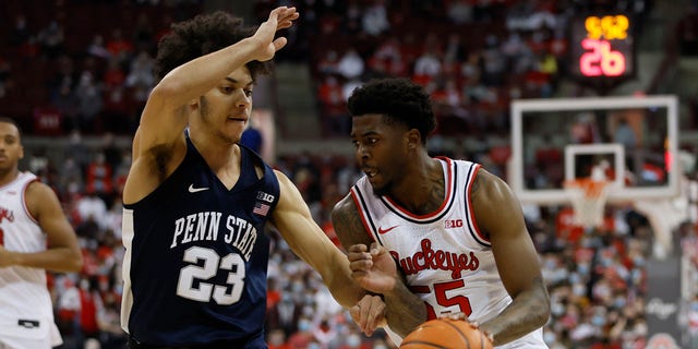 Ohio State's Jamari Wheeler, right, brings the ball up court as Penn State's Dallion Johnson defends during the second half of an NCAA college basketball game Sunday, Jan. 16, 2022, in Columbus, Ohio.
