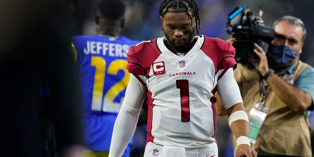 Arizona Cardinals quarterback Kyler Murray, #1, walks off the field after the Los Angeles Rams defeated the Cardinals in an NFL wild-card playoff football game in Inglewood, Calif., Monday, Jan. 17, 2022.