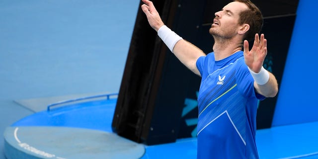 Andy Murray of Britain reacts after defeating Nikoloz Basilashvili of Georgia in their first round match at the Australian Open tennis championships in Melbourne, Australia, martedì, Jan. 18, 2022.
