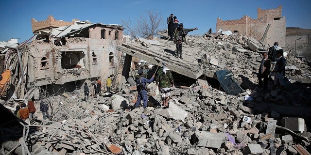 US Condemns Houthi Drone Attack On UAE Oil Facility - Fox News 2 Yemenis inspect the wreckage of buildings after they were hit by Saudi-led coalition airstrikes, in Sanaa, Yemen, Tuesday, Jan. 18, 2022. (AP Photo/Hani Mohammed)