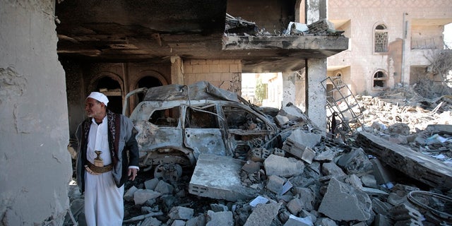 US Condemns Houthi Drone Attack On UAE Oil Facility - Fox News 4 A man inspects the wreckage of a building after it was damaged in Saudi-led coalition airstrikes, in Sanaa, Yemen, Tuesday, Jan. 18, 2022.
