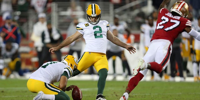 FILE -Green Bay Packers kicker Mason Crosby (2) kicks the game winning field goal from the hold of Corey Bojorquez during the second half of an NFL football game against the San Francisco 49ers in Santa Clara, Calif., Sunday, Sept. 26, 2021. The Packers and 49er meet Saturday, Jan. 22, 2022.