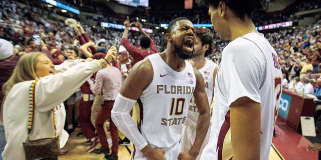 Florida State forward Malik Osborne (10) and forward John Butler (22) celebrate beating Duke 79-78 in overtime of an NCAA college basketball game in Tallahassee, Fla., Tuesday Jan. 18, 2022.