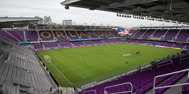 FILE - Players with Toronto FC, right, and Orlando City stand on the pitch at Exploria Stadium before an MLS soccer match, Saturday, June 19, 2021, in Orlando, Fla. The United States will play its final home World Cup qualifier at Orlando, Florida, on March 27 against Panama. The U.S. Soccer Federation announced Wednesday, Jan. 19, 2022, that the match will be at Exploria Stadium, where the Americans beat Panama 4-0 on Oct. 6, 2017, also their next-to-last qualifier.