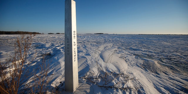 A border marker, between the United States and Canada is shown just outside of Emerson, Manitoba, on Thursday, Jan. 20, 2022.
