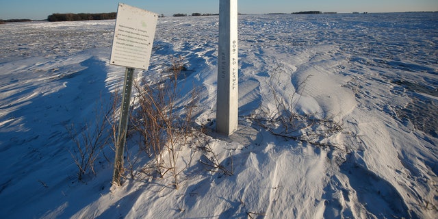 A border marker, between the United States and Canada is shown just outside of Emerson, Manitoba, on Thursday, Jan. 20, 2022.  