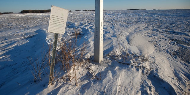 A border marker, between the United States and Canada is shown just outside of Emerson, Manitoba, on Thursday, Jan. 20, 2022.