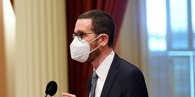 State Sen. Scott Wiener, D-San Francisco, addresses the state Senate at the Capitol in Sacramento, Calif., Tuesday, Jan. 18, 2022. Wiener is introducing, Friday, Jan. 21, 2022 a bill that would allow children ages 12 and up to be vaccinated without their parents consent. (AP Photo/Rich Pedroncelli)