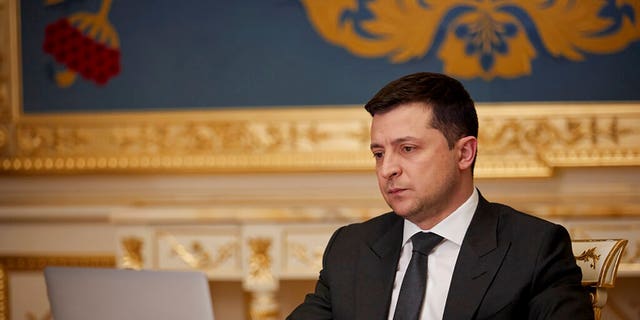 Ukrainian President Volodymyr Zelenskyy answers during his online interview for media in Kyiv, Ukraine, Friday, Jan. 21, 2022. (Ukrainian Presidential Press Office via AP)