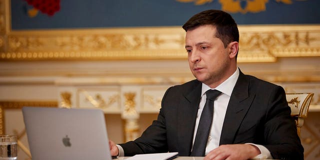 Ukrainian President Volodymyr Zelenskyy answers during his online interview for media in Kyiv, Ukraine, Friday, Jan. 21, 2022. (Ukrainian Presidential Press Office via AP)