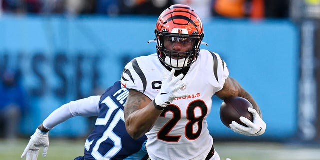 Cincinnati Bengals' Joe Mixon runs against the Tennessee Titans during the divisional playoff game, Jan. 22, 2022, in Nashville.