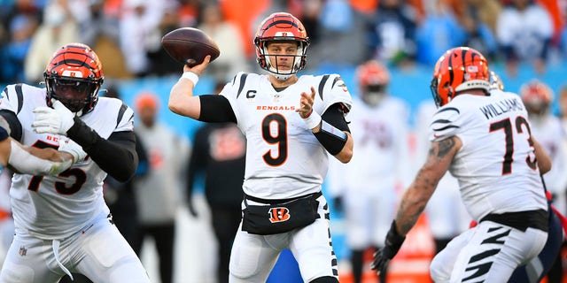 Cincinnati Bengals quarterback Joe Burrow (9) passes from the pocket against the Tennessee Titans during a divisional playoff game, Jan. 22, 2022, in Nashville.