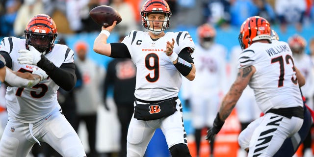 Cincinnati Bengals quarterback Joe Burrow (9) passes from the pocket against the Tennessee Titans during a divisional playoff game, Jan. 22, 2022, in Nashville.
