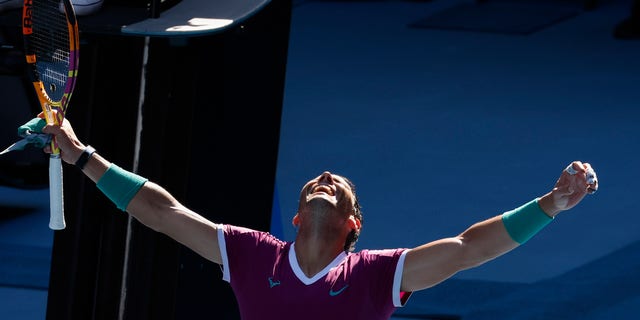 Rafael Nadal of Spain celebrates after defeating Adrian Mannarino of France in their fourth round match at the Australian Open tennis championships in Melbourne, Australia, Sunday, Jan. 23, 2022.