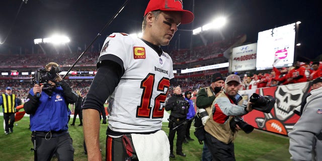 Tampa Bay Buccaneers quarterback Tom Brady (12) reacts as he leaves the field after the team lost to the Los Angeles Rams during an NFL divisional round playoff football game Sunday, Jan.. 23, 2022, in Tampa, Fla.