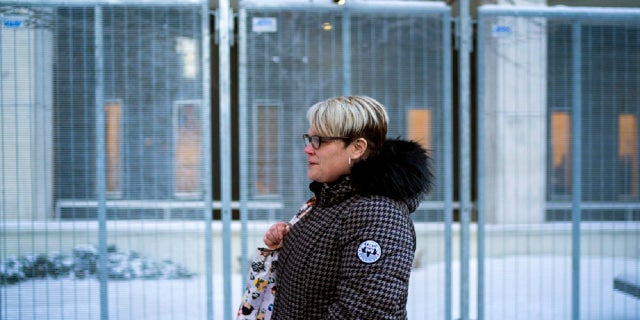 George Floyd's girlfriend Courtney Ross leaves the U.S. Federal Courthouse after the first day of testimony in the federal trial of three former Minneapolis police officers implicated in Floyd's death on Monday, Jan. 24, 2022, in St. Paul, Minn.