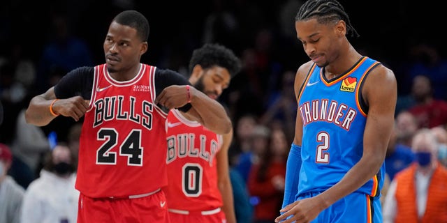 Oklahoma City Thunder guard Shai Gilgeous-Alexander (2) reacts in front of Chicago Bulls forward Javonte Green (24) after missing a basket in the final seconds of the an NBA basketball game Monday, Jan. 24, 2022, in Oklahoma City.