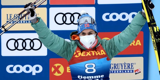 FILE - Heidi Weng of Norway celebrates on the podium after winning the women's Mass Start Free 10km event at the Tour de Ski in Val di Fiemme, Trento, Italy, January 4, 2022. (AP Photo/Giovanni Auletta, File)