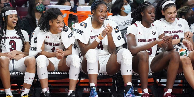 South Carolina guard Destanni Henderson (3), Zia Cooke (1), Aliyah Boston (4), Laeticia Amihere (15) and Kamilla Cardoso, right, watch from the bench during the second half of an NCAA college basketball game against Mississippi Thursday, Jan. 27, 2022, in Columbia, S.C. South Carolina won 69-40.