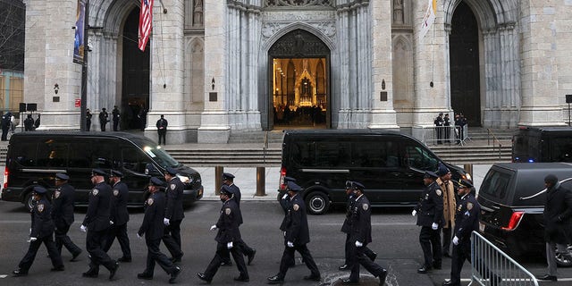 New York Police officers gather for the funeral of Officer Jason Rivera, Friday, Jan. 28, 2022, outside St. Patrick's Cathedral in New York. (AP Photo/Yuki Iwamura)