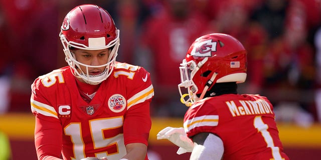 Kansas City Chiefs quarterback Patrick Mahomes (15) hands the ball off to running back Jerick McKinnon (1) during the first half of the AFC championship NFL football game against the Cincinnati Bengals, Sunday, Jan. 30, 2022, in Kansas City, Mo.