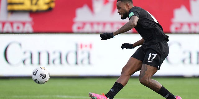 Canada's Cyle Larin scores against the United States during the first half of a World Cup soccer qualifier in Hamilton, Ontario, Sunday, Jan. 30, 2022.