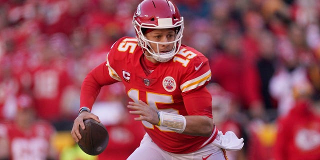 Kansas City Chiefs quarterback Patrick Mahomes (15) looks to pass during the first half of the AFC championship NFL football game against the Cincinnati Bengals, Sunday, Jan. 30, 2022, in Kansas City, Mo.