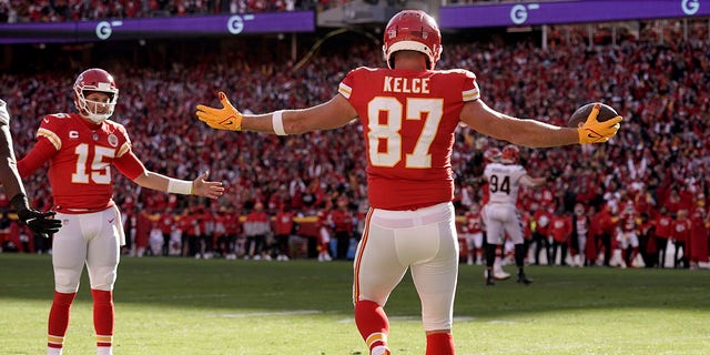Kansas City Chiefs tight end Travis Kells (87) celebrates after catching a 5-yard touchdown pass from quarterback Patrick Mahomes (15) during the first half of an AFC Championship NFL football game against the Cincinnati Bengals, Sunday, January 30, 2022 celebrated.  In Kansas City, Mo.