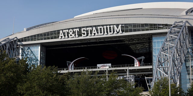 FILE - The outside of AT&amp;T Stadium is shown with the end zone doors open before an NFL football game between the Dallas Cowboys and the Cleveland Browns in Arlington, Texas, Sunday, Oct. 4, 2020.