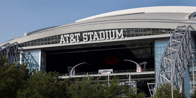 FILE - The outside of AT&T Stadium is shown with the end zone doors open before an NFL football game between the Dallas Cowboys and the Cleveland Browns in Arlington, Texas, Sunday, Oct. 4, 2020.