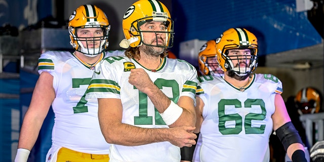 Aaron Rodgers (12) of the Green Bay Packers leads his team out before the game against the Detroit Lions at Ford Field on Jan. 9, 2022, a Detroit, Michigan.
