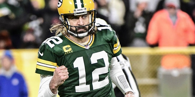 Green Bay Packers quarterback Aaron Rodgers reacts after throwing a touchdown against the Cleveland Browns at Lambeau Field on Dec 25, 2021.