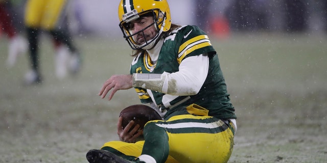 Green Bay Packers' Aaron Rodgers reacts after being sacked by San Francisco 49ers' Arik Armstead during the second half of an NFC divisional playoff NFL football game Saturday, Jan. 22, 2022, in Green Bay, Wis.