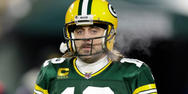 Green Bay Packers' Aaron Rodgers warms up before an NFC divisional playoff NFL football game against the San Francisco 49ers Saturday, Jan. 22, 2022, in Green Bay, Wis.