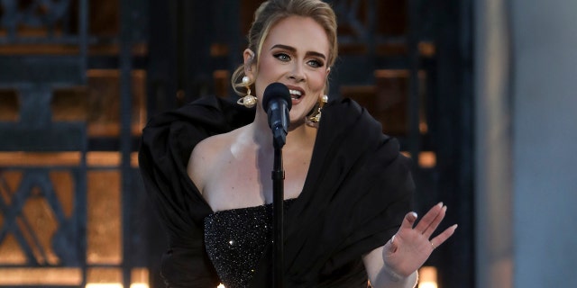 Adele is postponing her Las Vegas residency.