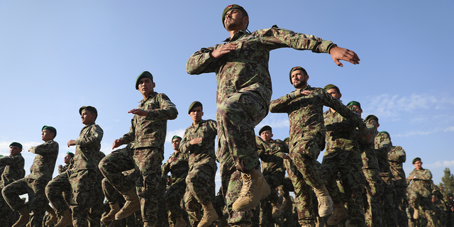 Newly graduated Afghan National Army personnel march during their graduation ceremony after a three-month training program at the Afghan Military Academy in Kabul, Afghanistan, in November 2020.