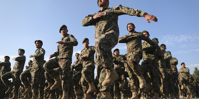 Newly graduated Afghan National Army personnel march during their graduation ceremony after a three-month training program at the Afghan Military Academy in Kabul, Afghanistan, in November 2020.