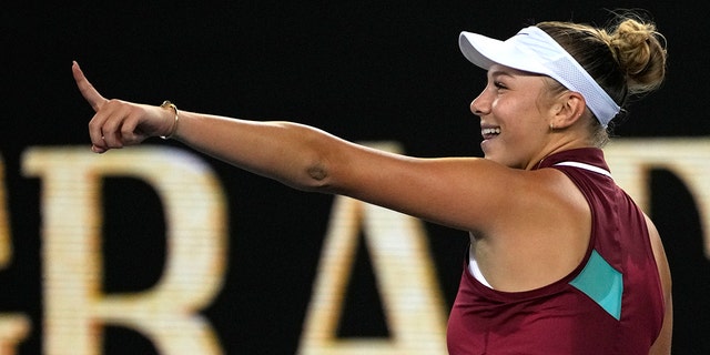 Amanda Anisimova of the U.S. celebrates after defeating Naomi Osaka of Japan in their third-round match at the Australian Open tennis championships in Melbourne, Australia, Friday, Jan. 21, 2022.
