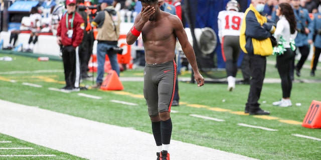 Antonio Brown leaves the field after throwing his equipment into the stands Sunday, Jan. 2, 2022, in East Rutherford, New Jersey.