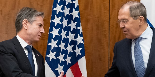 Secretary of State Antony Blinken greets Russian Foreign Minister Sergey Lavrov before their meeting, Friday, Jan. 21, 2022, in Geneva, Switzerland. 