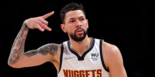 Denver Nuggets guard Austin Rivers reacts after making a 3-point basket against the Brooklyn Nets during the second half of an NBA basketball game Wednesday, Jan.. 26, 2022, In New York. The Nuggets won 124-118.
