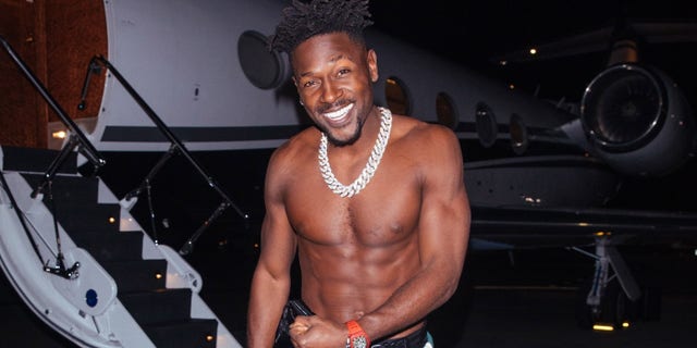 Antonio Brown steps off his private jet to meet with Kanye West at Craig's in West Hollywood.