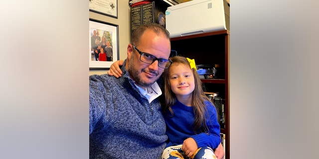 Michigan father Björn Olson with his daughter Lexi.