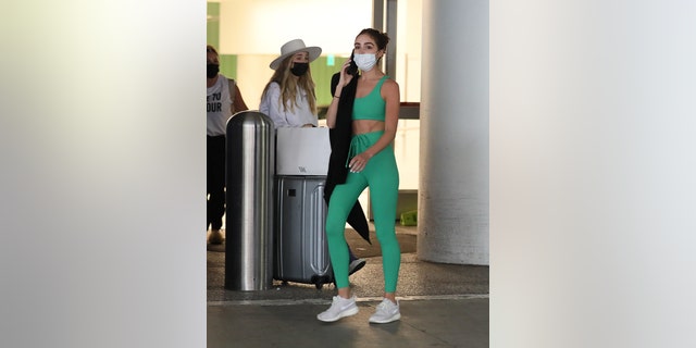 Olivia Culpo is seen at LAX after American Airlines reportedly made her cover up her last revealing outfit.