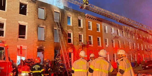 Photo shows Baltimore firefighters at scene of blaze on Jan. 24, 2022.