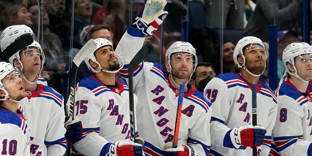 New York Rangers center Barclay Goodrow (21) waves to the crowd after the Tampa Bay Lightning played a video tribute to Goodrow during the first period of an NHL hockey game Friday, Dec. 31, 2021, in Tampa, Fla. Goodrow won a Stanley Cup with the Lightning.