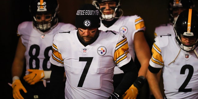 Ben Roethlisberger #7 of the Pittsburgh Steelers leads the team onto the field for warmups before the game against the Kansas City Chiefs in the NFC Wild Card Playoff game at Arrowhead Stadium on January 16, 2022 in Kansas City, Missouri.